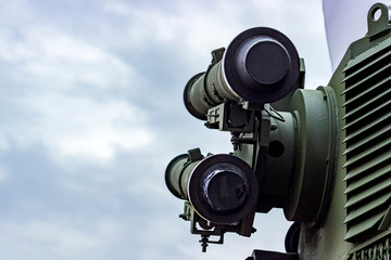 Launcher. The symbol of war. Anti-aircraft missiles on a background of trees. Military missiles.