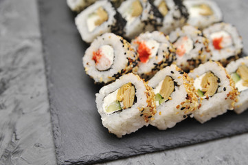 Japanese rolls on stone background.
