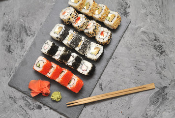 Japanese rolls on stone background.