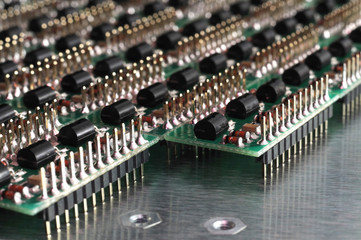 Close-up side view of a PCB board with SMD components