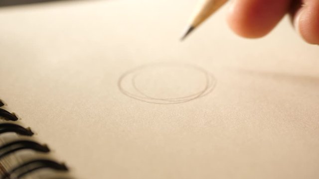 Hand drawing a flat line with a black pencil