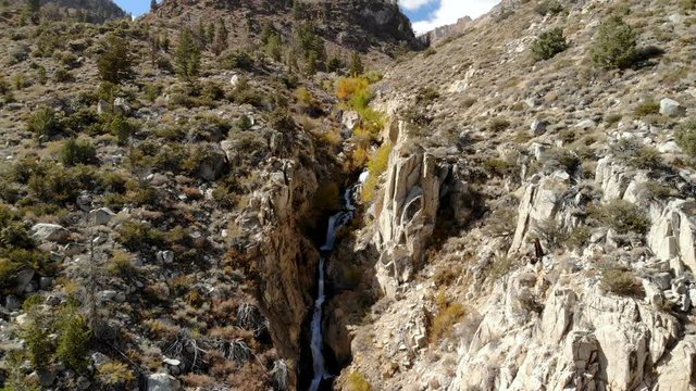 Aerial Shot of Runoffs thru Rugged Canyon in Sierra Nevada -Fly Over-