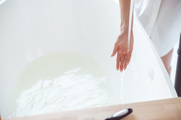 Close up of female person that preparing for washing
