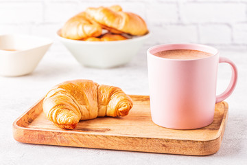 French croissants and cup of coffee.