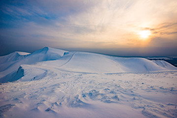 Bewitching view of the foggy sunny ski slope
