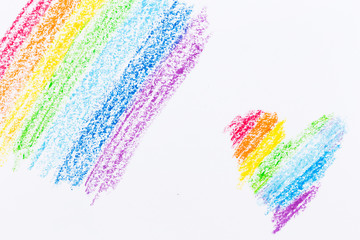 Wax crayon hand drawing heart rainbow background