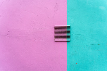 pink house facade texture in Burano, Italy