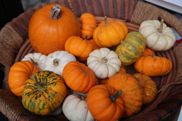 Decorative yellow pumpkin on wooden table.