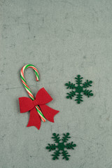 candy cane on a green background for new year with copy space