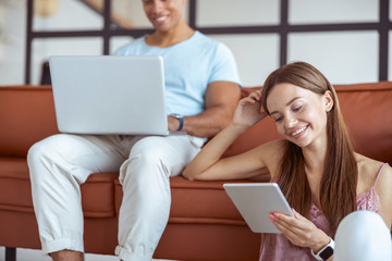 Close up of charming girl that checking news