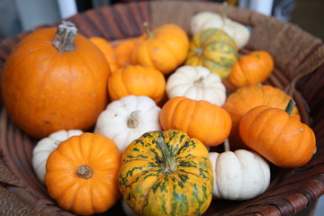 Decorative yellow pumpkin on wooden table.