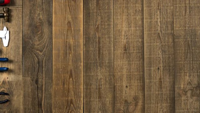 Stop motion animation of repair tools on a wooden table. Theme stopmotion hand tools for logo intro. Concept of brand promotion for the provision of repair services, locksmith or woodworker.