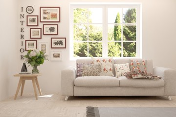 Stylish room in white color with sofa and summer landscape in window. Scandinavian interior design. 3D illustration