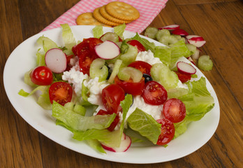 Cottage Cheese Salad with Fruit and Vegetables on Rustic Wood Table
