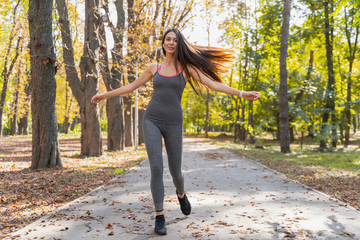 Beautiful woman beginning her morning exercises outside