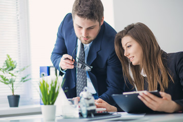 Young businessman discussing something with his colleague