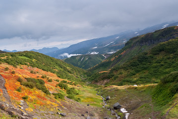 green hilly area, green mountains and mountain river, autumn mountain landscape