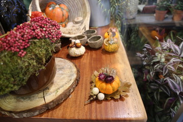 Decorative colorful pumpkins on wooden table.