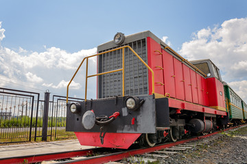 vintage steam train hurtling at speed along the rails close-up, retro vehicle, steam engine, locomotive