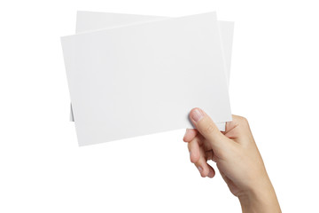 Fototapeta premium Hand holding two small sheets of paper (tickets, flyers, invitations, coupons, banknotes, etc.), isolated on white background