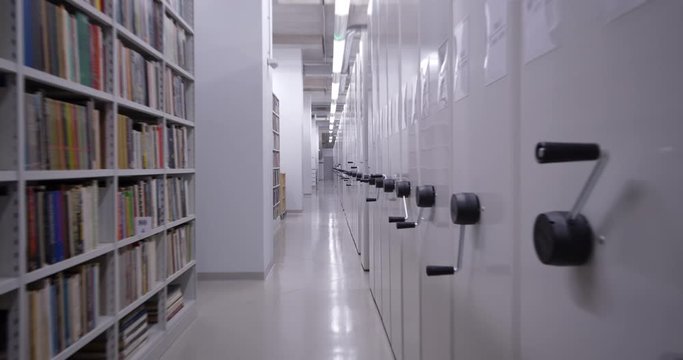 4K - Camera moves around the book storage