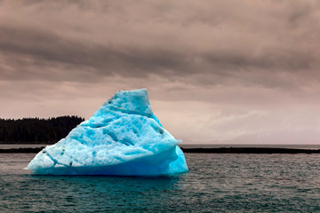 Blue Iceberg on an overcast day on Ocean