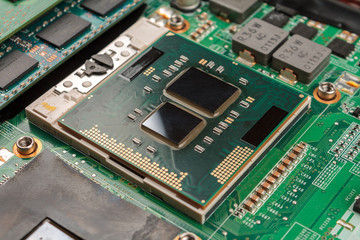 computer CPU close-up on the motherboard background, socket of central process unit, connection of  cpu with motherboard,  the structure of the processor chip, multi-core and multi-threading