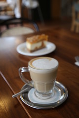 Cheesecake with walnuts and pumpkin and flat white.turkey