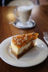 Cheesecake with walnuts and pumpkin and flat white.turkey