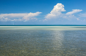 Clear tropical water and cumulus clouds on the horizon, Koh Rong island, Cambodia