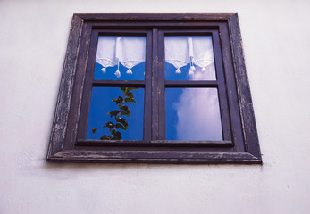 Old village house glass with inside view.