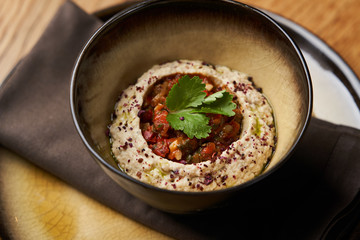 Baba ganoush hummus with eggplant on wooden table background.