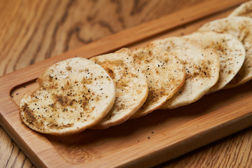 Matzah - Jewish traditional Passover bread on wooden table.
