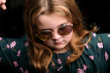 Young Girl In The Studio With Sunglasses