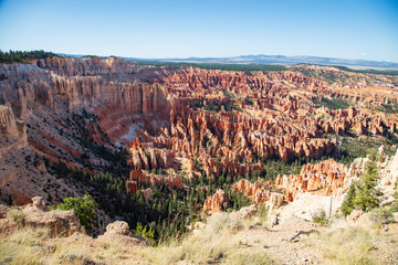 The spectacle of thousands of glowing orange earthen spires concentrated in the valley below the...