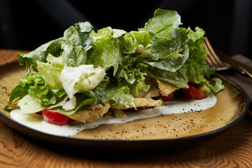 Dietary chicken salad with avocado, cucumber, arugula, cherry tomatoes