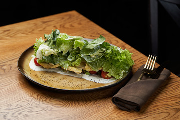 Dietary chicken salad with avocado, cucumber, arugula, cherry tomatoes