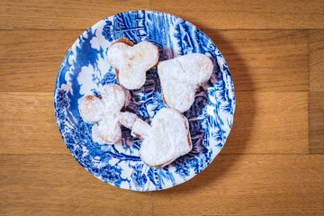 Vanilice (small Vanilla cookies) are bite-sized Serbian Vanilla cookies made as sandwich of two vanilla and walnut cookies held together with a dollop of jam, usually served around the Christmas