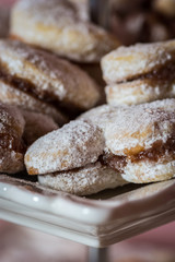 Vanilice (small Vanilla cookies) are bite-sized Serbian Vanilla cookies made as sandwich of two vanilla and walnut cookies held together with a dollop of jam, usually served around the Christmas