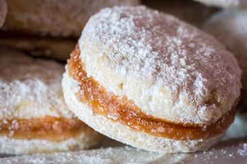 Vanilice (small Vanilla cookies) are bite-sized Serbian Vanilla cookies made as sandwich of two vanilla and walnut cookies held together with a dollop of jam, usually served around the Christmas