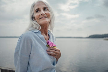 Senior woman at the sea, portrait