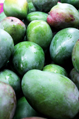 Fresh, green mangoes on the market.
