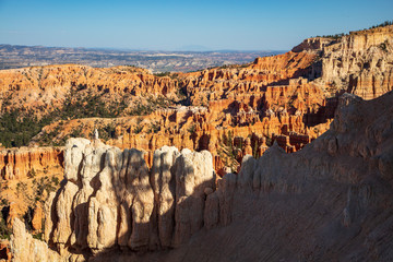 The spectacle of thousands of glowing orange earthen spires concentrated in the valley below the...