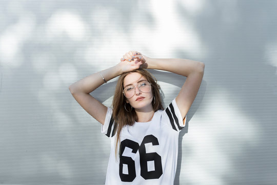 Portrait of young woman, wearing t-shirt with number 66