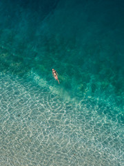 Woman floating in the sea, Gili Air, Gili Islands, Indonesia