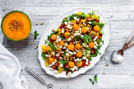 Directly above shot of fresh salad in plate on wooden table