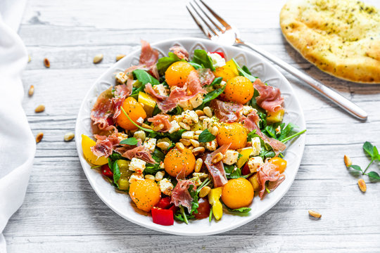 High angle view of healthy salad in plate on wooden table