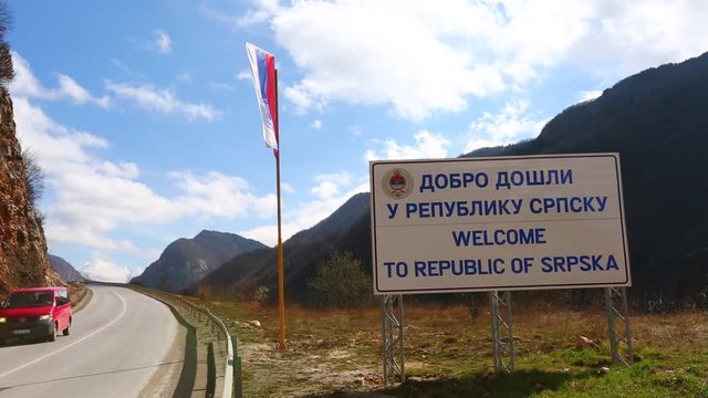 Serbian flag and a sign in cyrillic in the border between Bosnia and Srpska Republic