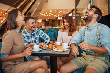 Group of friends having a coffee together