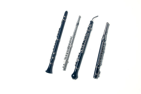 side-blown flute, clarionet, corno Inglese and piccolo flute isolated on white background